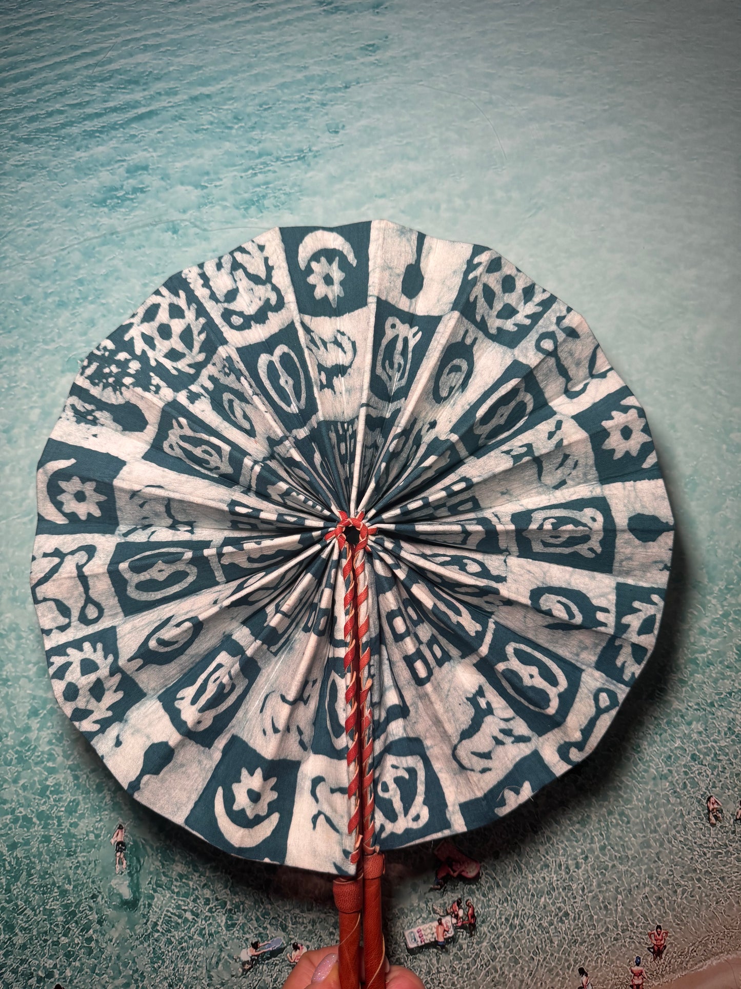 Green and White Print Fan